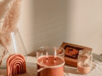 a table with a candle and a box of matches