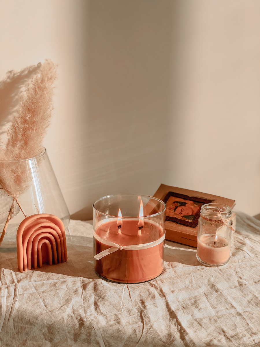 a table with a candle and a box of matches