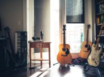 several guitars beside of side table