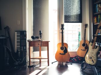 several guitars beside of side table